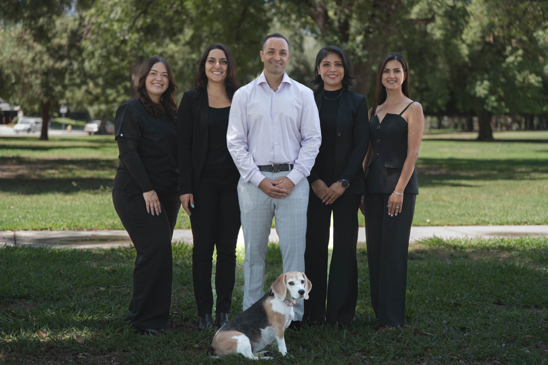 Dr. Edmond Ahdoot with the Smiles by Eddie team and the office dog
